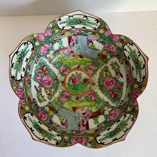 Dating to the late 19th century, this beautiful Chinese porcelain bowl features a graceful scalloped, petal-shaped rim and...