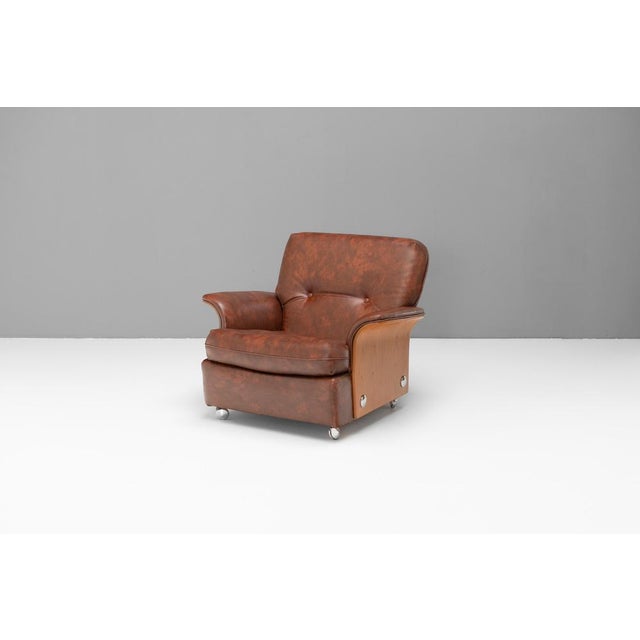 Single mid-century Tulip chair by G-Plan. with teak veneered bent ply-wood sides and back with exaggerated chrome buttons....