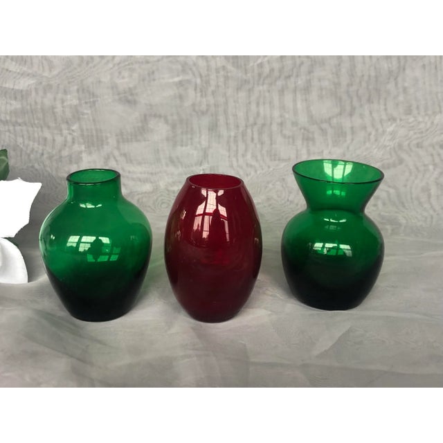 Fill these festive vintage red and green glass vases with seasonal flowers and use them as Christmas holiday decor. The...