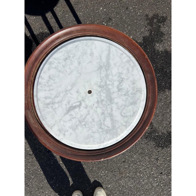 This Neoclassical style elegant round marble top accent table dates to approximately 1910–1920. The table features a...