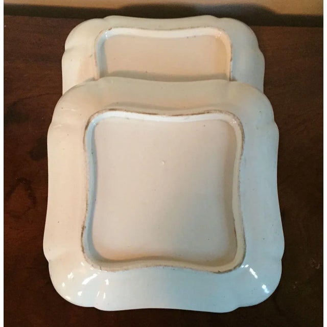 Pair early 19th c. Coalport porcelain square plates decorated in the French taste with hand painted floral sprigs...