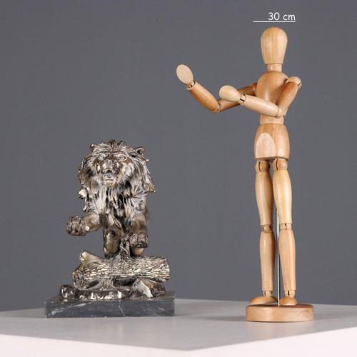 Silver-plated sculpture of a rampant lion, manufactured by Ottaviani. Marble base. This piece is attributed to the...