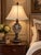 Commanding in both scale and ornament, this extra-tall vintage table lamp rises approximately 35 inches to the top of its...