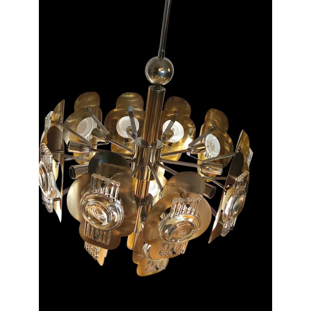 Magnificent 1970s chandelier designed by Oscar Torlasco This piece is attributed to the mentioned designer/maker. It has...