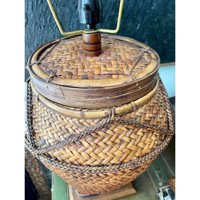Stunning pair of mid century lamps, previously woven split bamboo baskets that may predate age of lamp, these gorgeous...