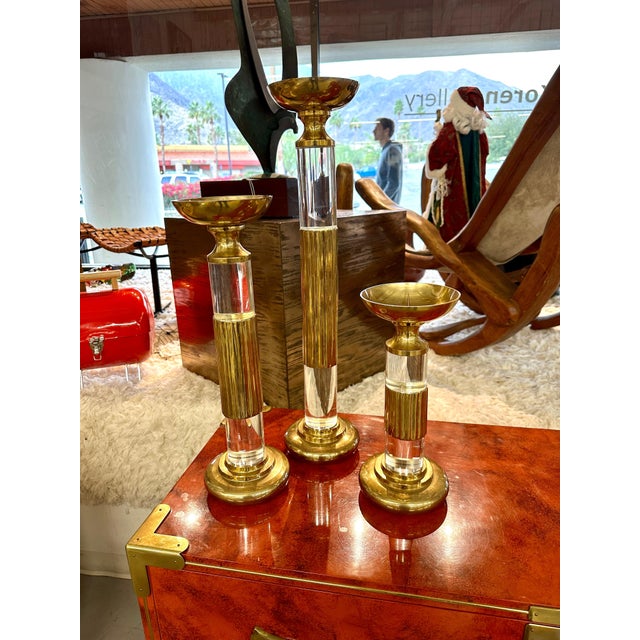 A pretty graduated set of Candlesticks or Prickets by Dolby Cashier from the 1980's. This was a brand name or trademark of...