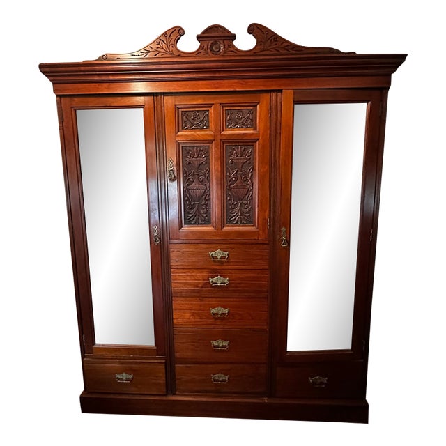 Late 19th Century Victorian Carved Walnut Triple Compactum Wardrobe With Beveled Mirror Doors For Sale