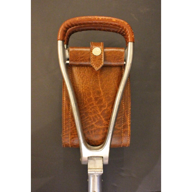 Circa 1960s English shooting stick or hunting walking stick. For hunting or sporting events with folding seat & disc which...