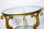 Just in! This French Art Deco Style Gilt Iron Round Two Tier, Beveled Glass Top Center Table with three scrolled legs....