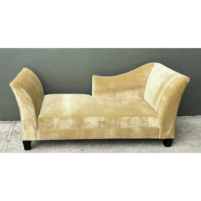 Showcasing dramatic sculptural lines, this vintage chaise lounge is upholstered in a distinctive diagonally striped velvet...