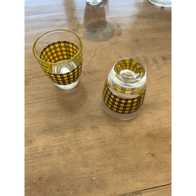 Diminutive and darling, this French decanter and shot glass set features brightly colored herringbone patterning. The...
