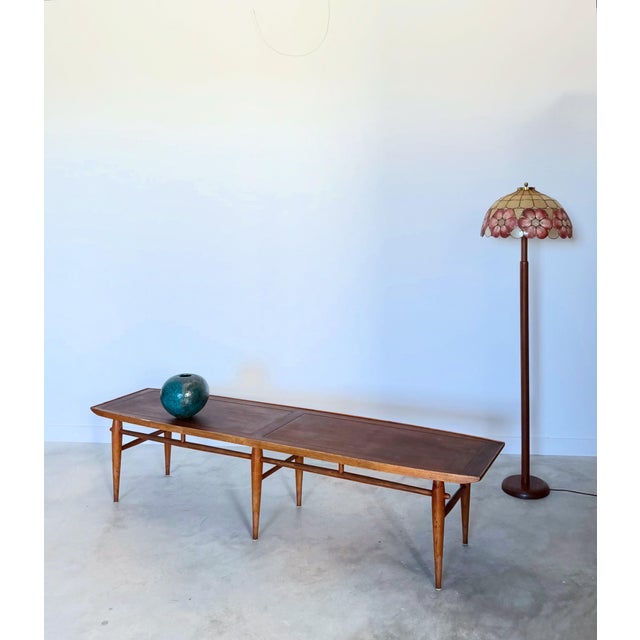 An extra long coffee/cocktail table from Lane Alta Vista's Copenhagen line in walnut and ash. Cleaned and oiled, without...