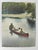 Early 20th century colortone advertising photograph of fishermen in a canoe. Unsigned. Unframed, spots around lower left...
