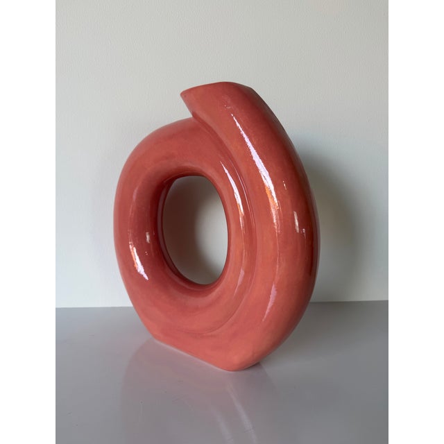 Striking 1980s Postmodern sculptural ceramic vase by Jessica, featuring a bold circular form with a sweeping asymmetrical...