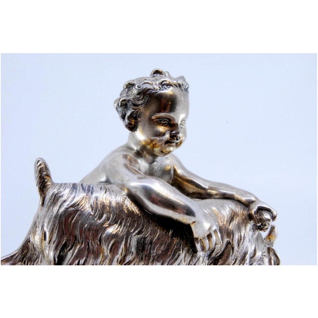 Naked Child with Animal Figurine in Silver, in Very Good conditions. Designed before 1890 This piece has an attribution...