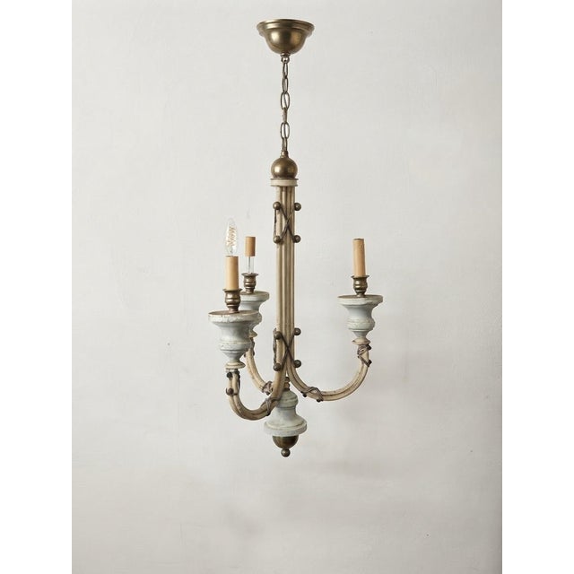 Maker: Hart Associates Color/Finish: Distressed white/cream, antiqued brass Lighting: 3 candelabra-base sockets Condition:...