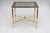 This stylish three piece set of brass nesting tables date to the 1970s and are attributed to Maison Jansen. It is...