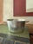 A Le Cordon Bleu French aluminum pan marked “Made in France,” featuring a simple cylindrical form with double side...