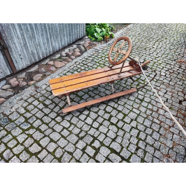 Pre-war ice sleigh with brake and steering wheel, dimensions width 115 cm, height to handlebar 56 cm, depth 40.5 cm,...