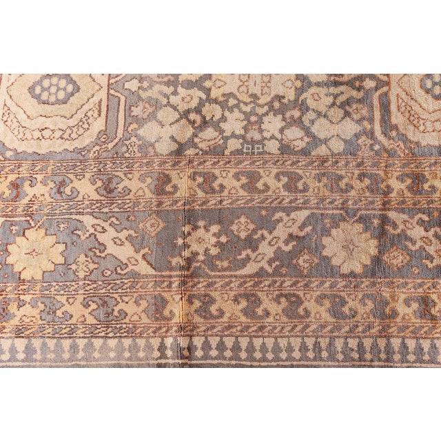 This exquisite Hereke rug from the 1920s showcases the extraordinary craftsmanship and artistry synonymous with antique...