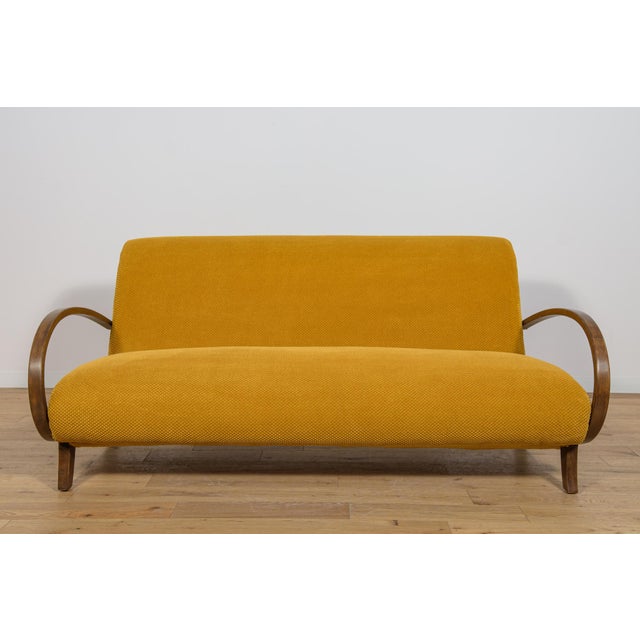 Three-seater sofa in the Art Deco style, manufactured in Poland in the 1930s. Sofa after comprehensive renovation. Beech...
