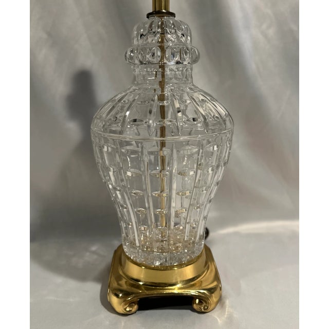 A cut lead crystal Chinoiserie style table lamp standing on a brass base. This ginger jar form lamp is a blend of Asian...