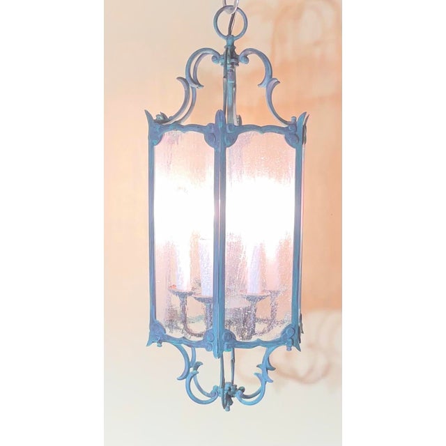 exquisite antique lantern chandelier, meticulously crafted from solid brass. This piece is not just a light fixture; it is...