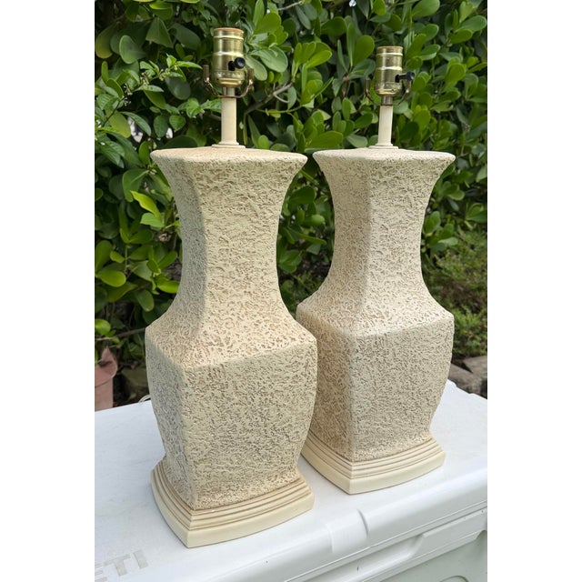 Pair of vintage 1992 ROD International table lamps featuring sculptural forms with heavily textured faux-plaster finishes....