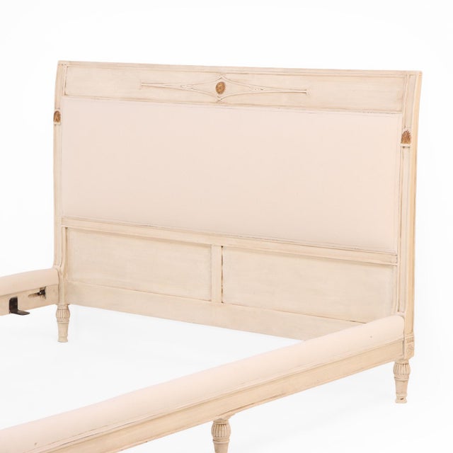 A handsome French Directoire style bed with subtle neoclassical carved details. New fabric throughout. Interior- Wd:...