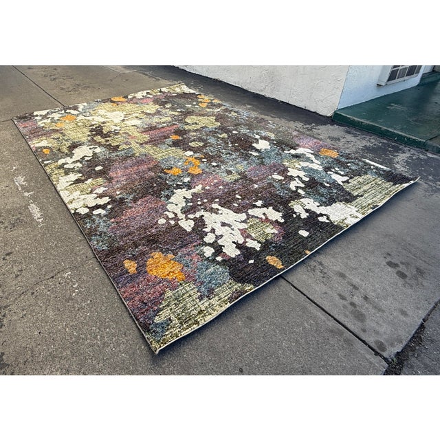 Design Plus Gallery presents the 8ft 6in × 11ft 7in Evolution Area Rug in Navy/Green from Oriental Weavers. This rug is an...