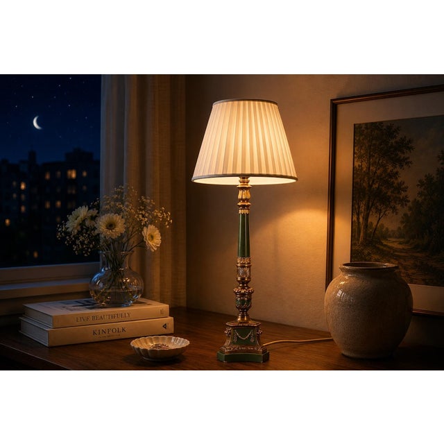 A tall and elegant vintage table lamp combining polished brass with a deep green lacquered central column, creating a...