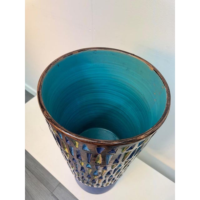 An extraordinary geometric design art vase made from textured glazed ceramic hand painted in cobalt blue, yellow and...
