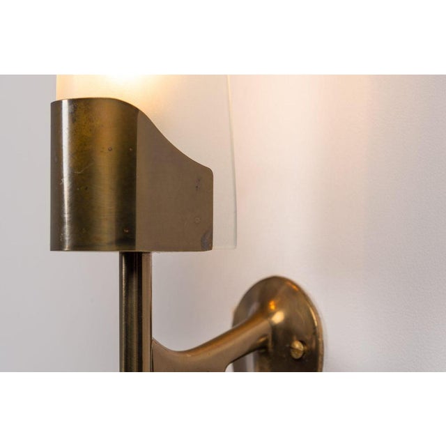 This exquisite and rare pair of model 2080 wall lamps was designed by the legendary max ingrand and produced by the...