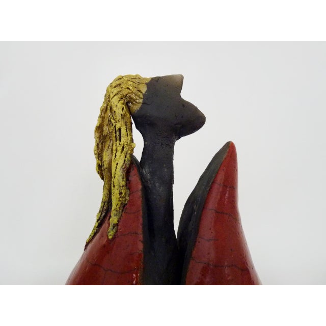 Raku terracotta sculpture by JES A beautiful sculpture depicting a blonde woman poking her head out of her home. This is a...
