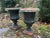 A good pair of antique 19th century American Classical cast iron garden urns with old green paint. Wonderful weathered...