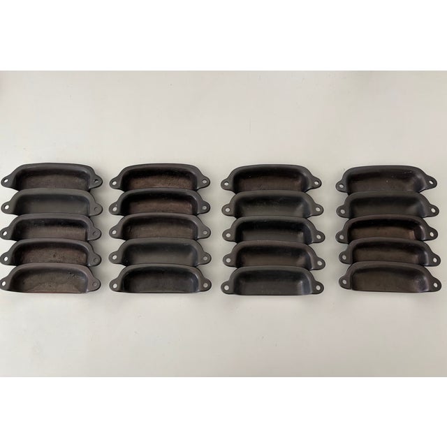 This vintage set of 20 cabinet pulls are solid and hefty, not thin and light as some others these days. All in very good...