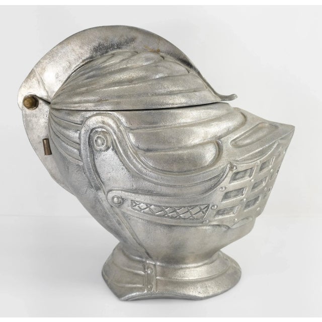 We are selling this great mid-century style ice bucket in the form of a helmet. The medieval helmet is made of a pewter...
