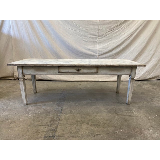Beautiful 19th C Italian coffee table, with faux marble top, and center drawer. This stylish table is classic in design,...