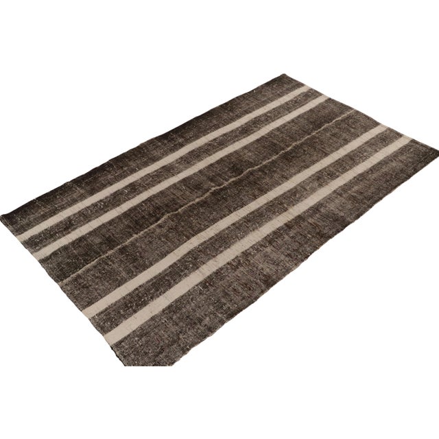 Originating between 1950-1960, a 6x10 vintage kilim rug from Turkey. Handwoven in wool with panel weaving technique, the...