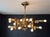 A mid century modern Italian 18 light chandelier made of brushed brass by Gaetano Sciolari. Made in Italy. Circa 1970’s....