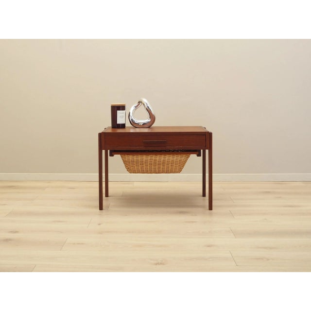 The coffee table was made in the 1970s, Danish production. The structure and tabletop are covered with teak veneer. The...