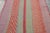Handwoven in wool circa 1950–1960, this 4x6 vintage Kilim, woven in the tradition of a Frazada textile, is a vibrant...
