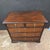 This Georgian 5 Drawer Oak Chest With Dark Cherry Banding With Brass Drop Pulls & Ecutcheons is set on bracket feet. It is...