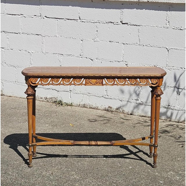 This elegant Louis XVI Revival Wall Console was handcrafted in France and is distinguished by its timeless design....