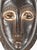 The Baule portrait mask discussed is intricately crafted for the Mblo dance, representing an honored person or ancestor in...