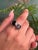 This elegant two-stone ring is crafted from 925 Sterling Silver and features the timeless beauty of oval-cut garnets. Each...