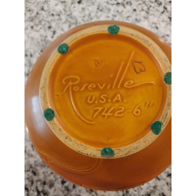 Roseville Pottery was founded in 1890. This piece with its intricate design, was completed around 1950 and is in excellent...