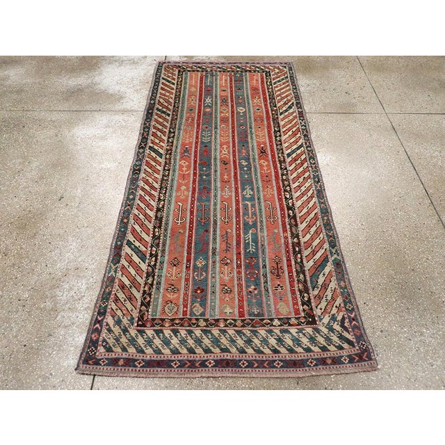 An antique Caucasian Karabagh rug handmade during the Early 20th century. Measures: 3' 3" x 7' 1"