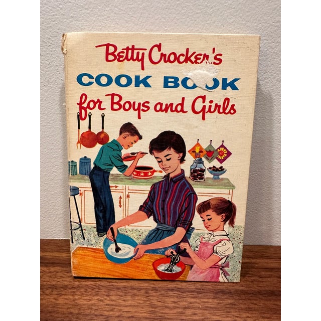 A set of three Betty Crocker hardcover spiral bound cookbooks. 8 x 6 x .5” 1. The 1957 1st edition/1st printing of Betty...