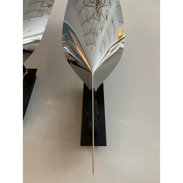 Sculptural wall lights in the style of Michel Boyer made of chrome-plated stainless steel, 1970s This piece is designed in...